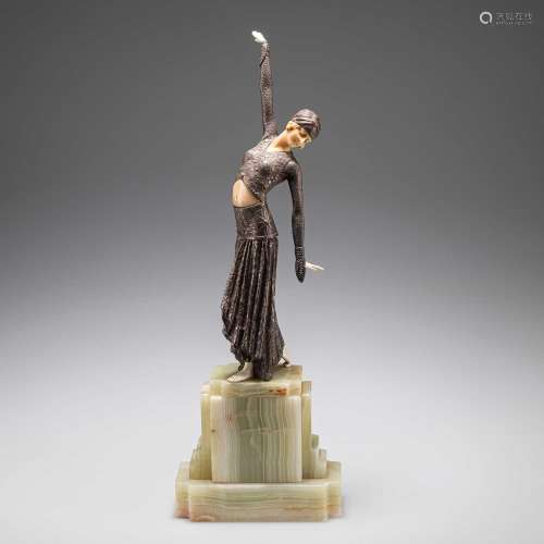 AN ART DECO BRONZE AND FAUX IVORY FIGURE