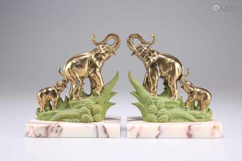 A PAIR OF ART DECO BRASS AND PAINTED \'ELEPHANT\' BOOKENDS