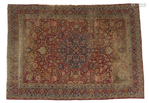 AN ANTIQUE PERSIAN LAVAR CARPET