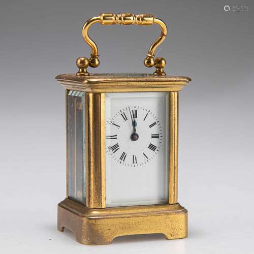 A BRASS-CASED MINIATURE CARRIAGE CLOCK