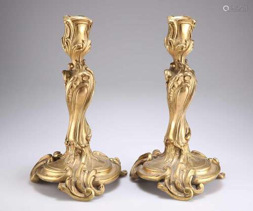 A PAIR OF ROCOCO REVIVAL ORMOLU CANDLESTICKS, 19TH CENTURY