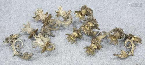 A PAIR OF ROCOCO STYLE ORMOLU FIVE LIGHT WALL SCONCES