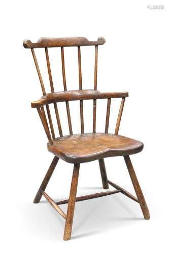 AN 18TH CENTURY PRIMITIVE ELM AND ASH COMB-BACK WINDSOR CHAI...