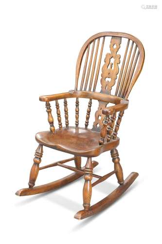 A PERIOD STYLE ELM AND OAK CHILD\'S ROCKING CHAIR