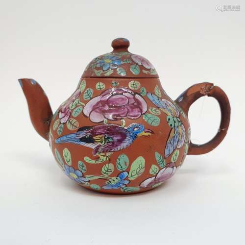 A Chinese red stoneware and enamel teapot, decorated birds a...