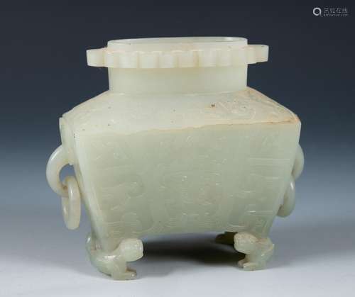 A Chinese carved jade censer, with ring handles, on dragon f...