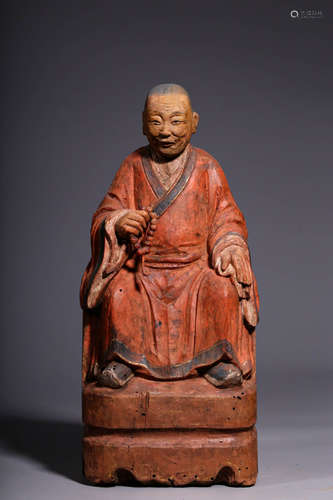 In the Qing Dynasty, a wooden statue of Arhat in red was car...