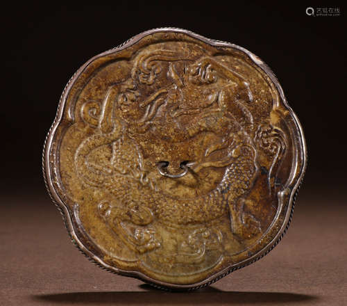 During or before the Ming Dynasty, pure silver inlaid with j...