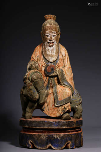 In the Ming Dynasty, the wooden carving and colored statue o...