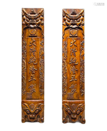 In the Qing Dynasty, a pair of Fengshui pillars were carved ...