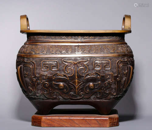 In the Qing Dynasty, a large bronze furnace with animal face...