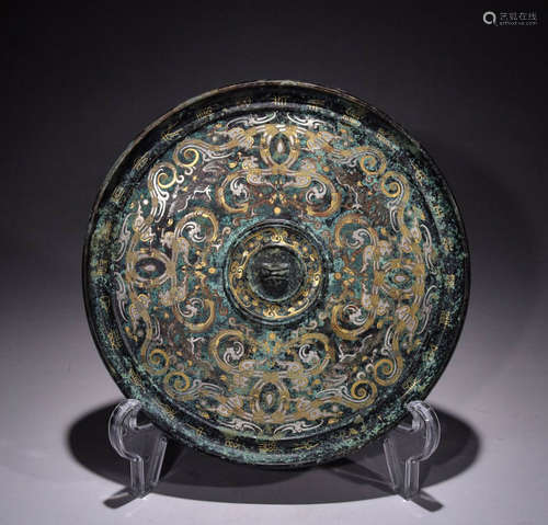 In the Qing Dynasty, bronze mirrors with inlaid gold and sil...