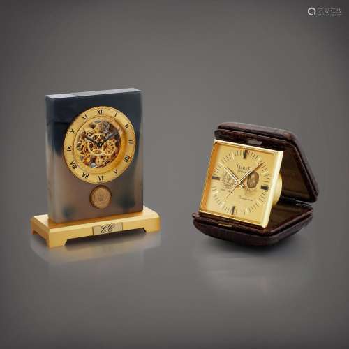 PiagetA set of two clocks, a gilt metal and agate skeletonis...
