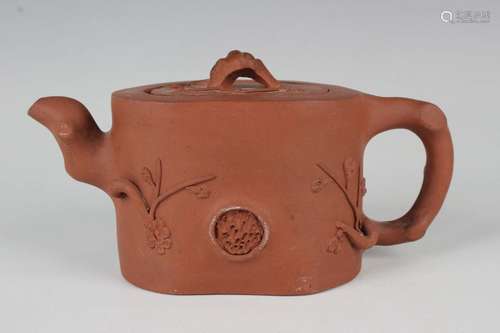 A Chinese Yixing stoneware teapot and cover