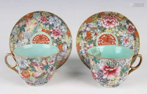 A pair of Chinese famille rose millefleurs porcelain cups an...