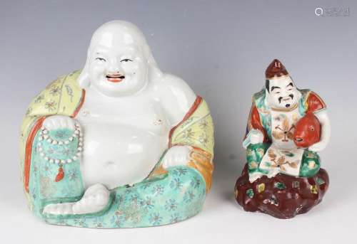 A Chinese porcelain figure of a seated smiling Buddha