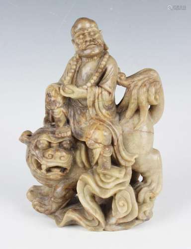 A Chinese carved soapstone figure group