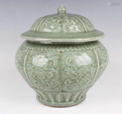 A Chinese celadon glazed wine jar and cover