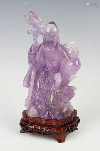A Chinese carved amethyst quartz figure of Shoulao and crane