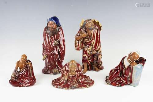 A Chinese Shiwan pottery sang-de-boeuf glazed figure of Li T...