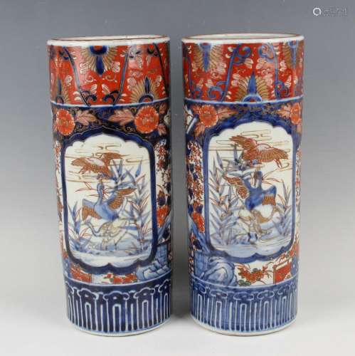 A pair of Japanese Imari cylinder vases