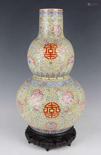 A Chinese famille rose enamelled yellow ground porcelain dou...