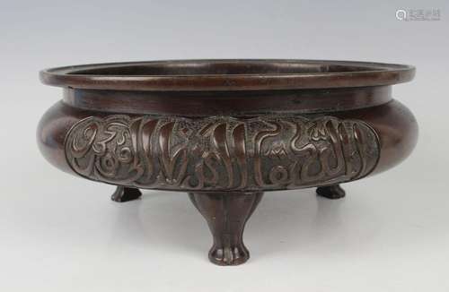 A Chinese brown patinated bronze tripod censer