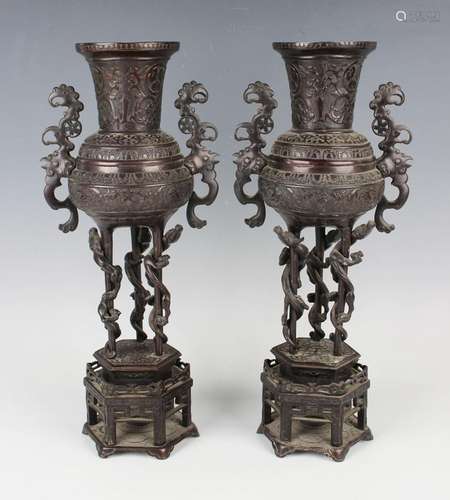 A pair of Japanese brown patinated bronze two-handled vases ...