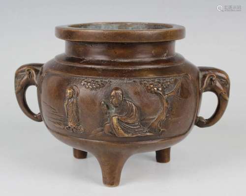 A Chinese brown patinated bronze tripod censer