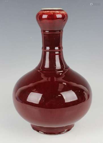 A Chinese sang-de-boeuf glazed porcelain bottle vase