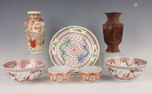 A pair of Chinese iron red decorated porcelain teabowls