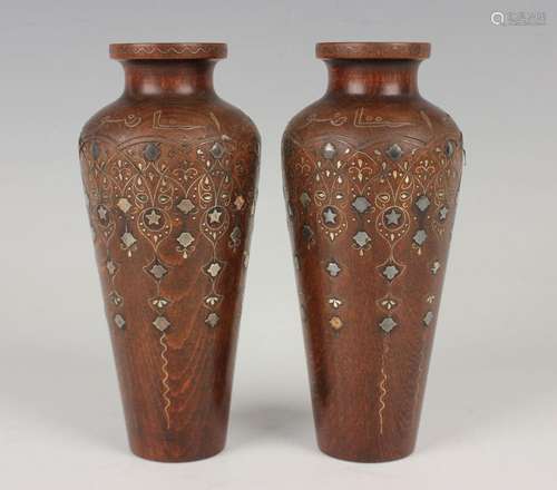 A pair of Islamic inlaid wooden vases