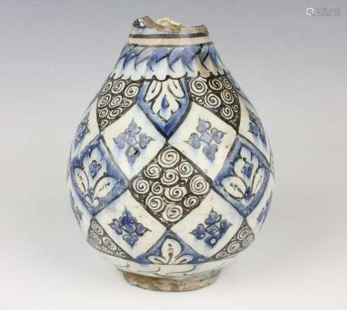 A Persian tin glazed earthenware bottle