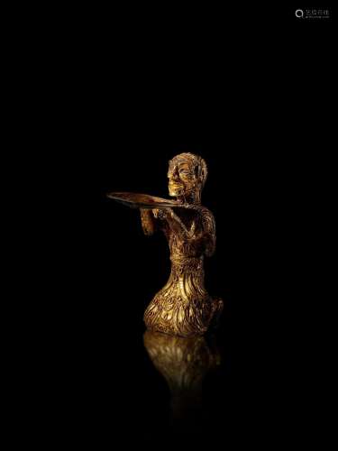 An important and exceedingly rare gold kneeling figure, West...