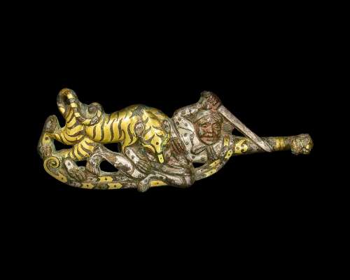 A rare gold and silver-inlaid bronze 'warrior and tiger' gar...