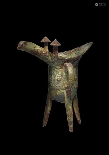 An inscribed archaic bronze ritual wine vessel, jue, Shang d...