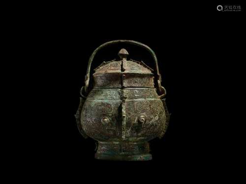 An extremely rare and important archaic bronze ritual wine v...
