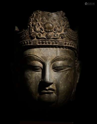 A monumental and extremely rare limestone head of Vairocana ...