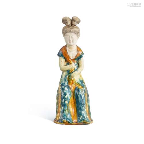 A blue-splashed and sancai seated figure of a lady, Tang dyn...