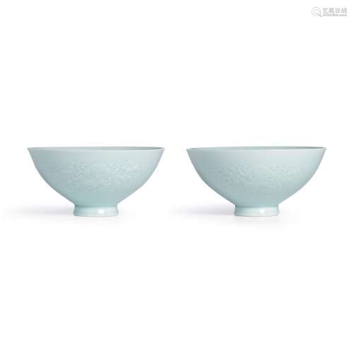 A rare pair of moulded celadon-glazed 'bat and gourd' bowls,...