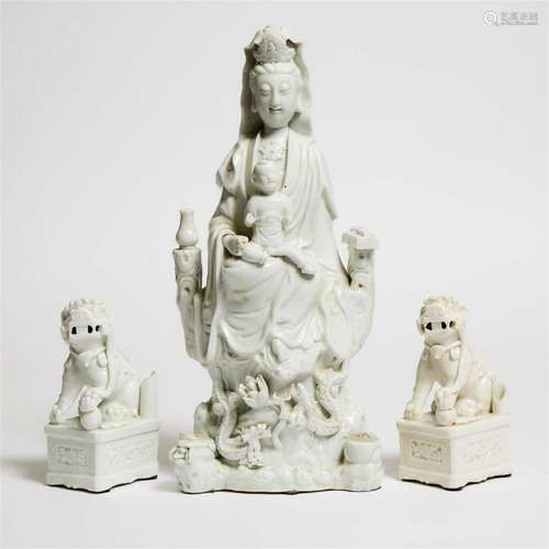 A Pair of Blanc de Chine Lions, Together With a Guanyin Gro