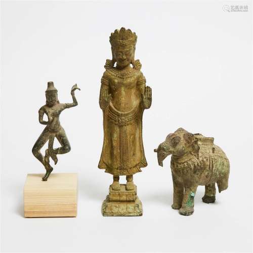 A Group of Three Khmer Bronze Goddesses and Elephant, 12th