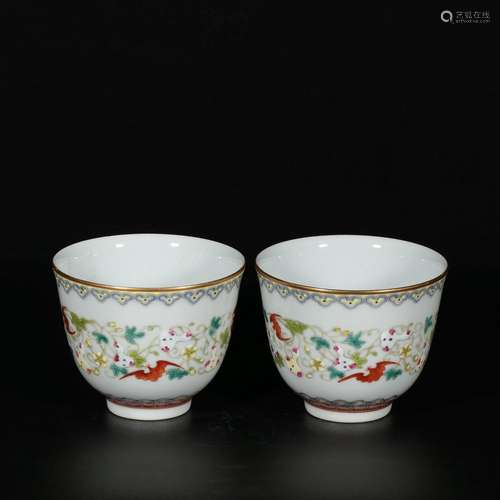 A pair of pastel cups with twining blessings and longevity p...