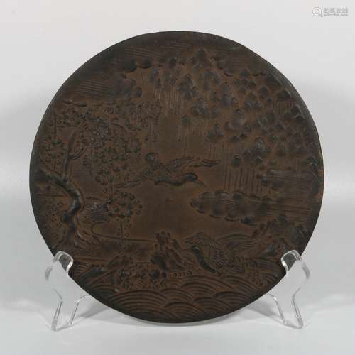 Plate with carved iron crane pattern