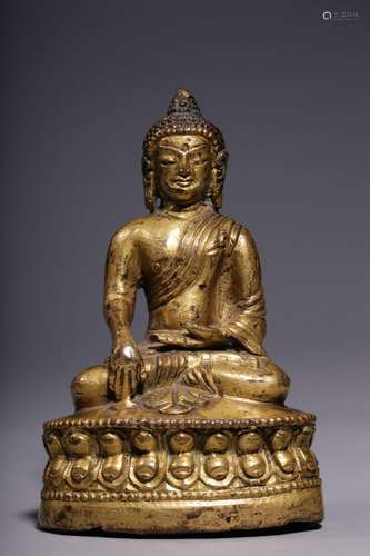 A gilt-bronze seated figure of Sakyamuni, Qing Dynasty (bott...