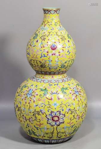 Yellow-ground famille rose gourd vase with twining branches ...