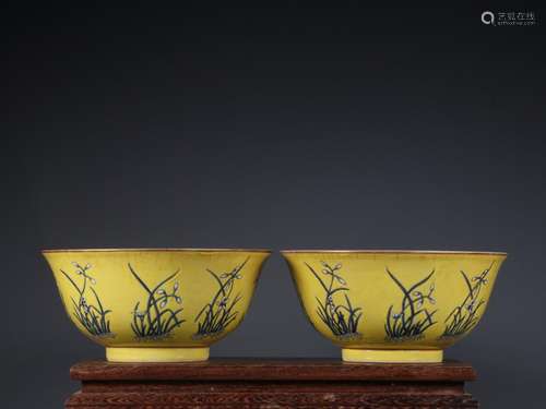 Pair of pastel orchid pattern bowls on yellow ground