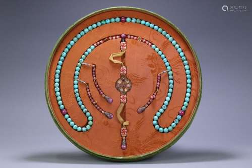 A plate of turquoise beads