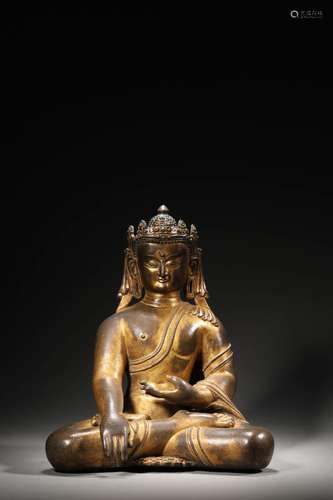 A GILT BRONZE BUDDA FIGURE