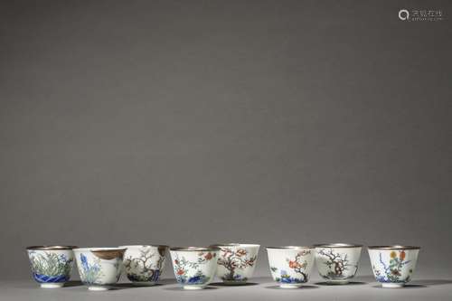 A SET OF EIGHT QING KANGXI PERIOD CUPS